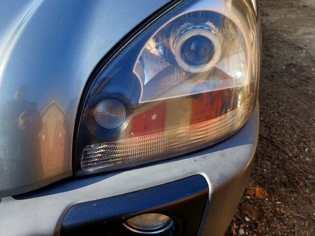 Серый Хендай Туксон, объемом двигателя 2 л и пробегом 178 тыс. км за 10000 $, фото 4 на Automoto.ua