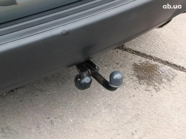 Сірий Хендай Туксон, об'ємом двигуна 2 л та пробігом 148 тис. км за 10390 $, фото 9 на Automoto.ua
