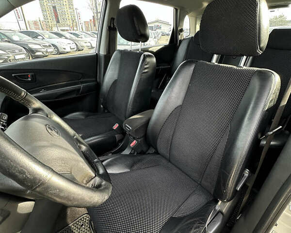 Сірий Хендай Туксон, об'ємом двигуна 1.98 л та пробігом 210 тис. км за 9999 $, фото 14 на Automoto.ua