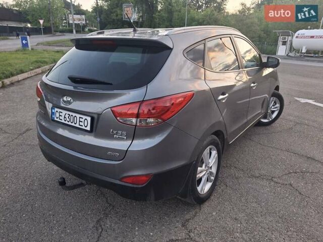 Серый Хендай Туксон, объемом двигателя 2 л и пробегом 212 тыс. км за 13600 $, фото 6 на Automoto.ua