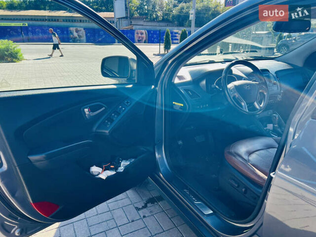 Сірий Хендай Туксон, об'ємом двигуна 2.4 л та пробігом 123 тис. км за 12500 $, фото 12 на Automoto.ua