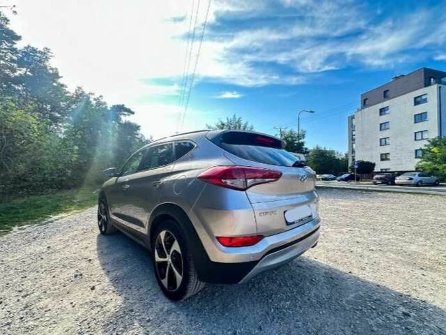 Серый Хендай Туксон, объемом двигателя 2.4 л и пробегом 94 тыс. км за 10700 $, фото 5 на Automoto.ua