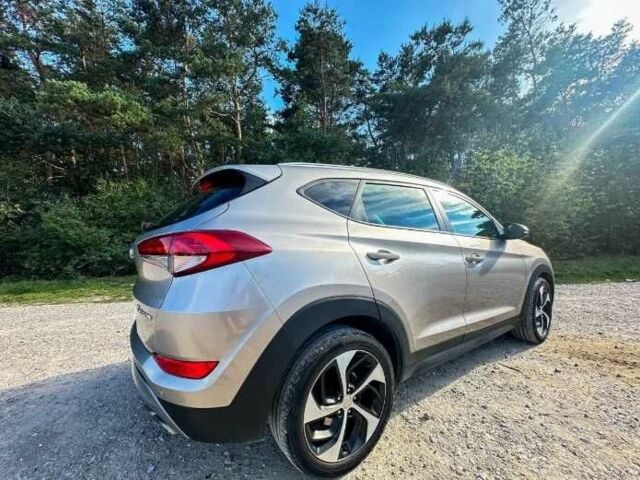 Серый Хендай Туксон, объемом двигателя 2.4 л и пробегом 94 тыс. км за 10700 $, фото 7 на Automoto.ua