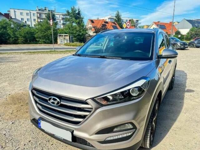 Серый Хендай Туксон, объемом двигателя 2.4 л и пробегом 94 тыс. км за 10700 $, фото 1 на Automoto.ua