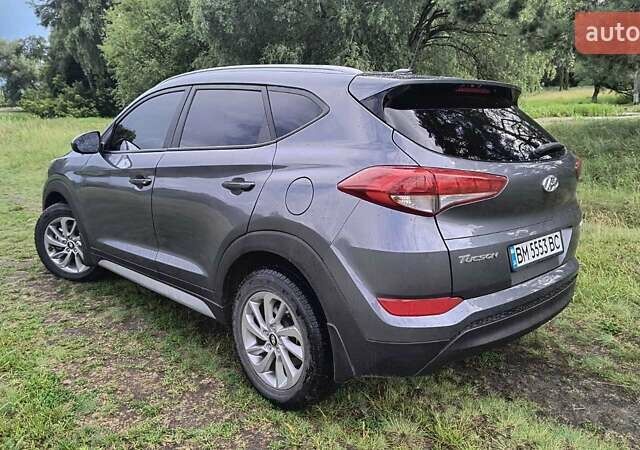 Серый Хендай Туксон, объемом двигателя 2 л и пробегом 133 тыс. км за 15300 $, фото 3 на Automoto.ua