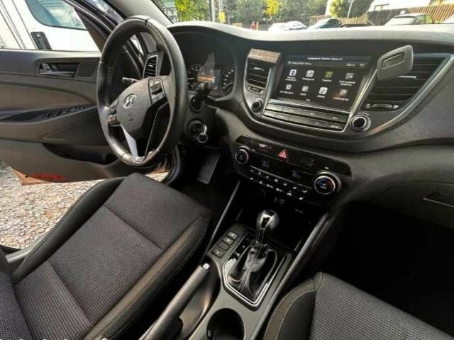 Серый Хендай Туксон, объемом двигателя 2.4 л и пробегом 94 тыс. км за 10700 $, фото 10 на Automoto.ua