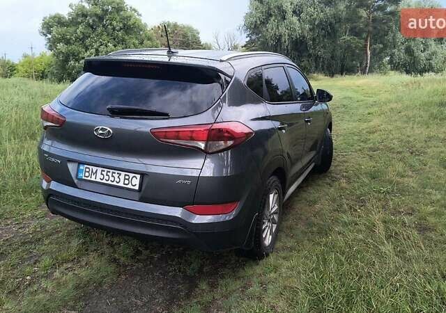Серый Хендай Туксон, объемом двигателя 2 л и пробегом 133 тыс. км за 15300 $, фото 5 на Automoto.ua