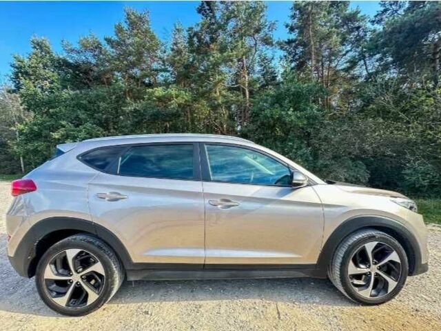 Серый Хендай Туксон, объемом двигателя 2.4 л и пробегом 94 тыс. км за 10700 $, фото 8 на Automoto.ua