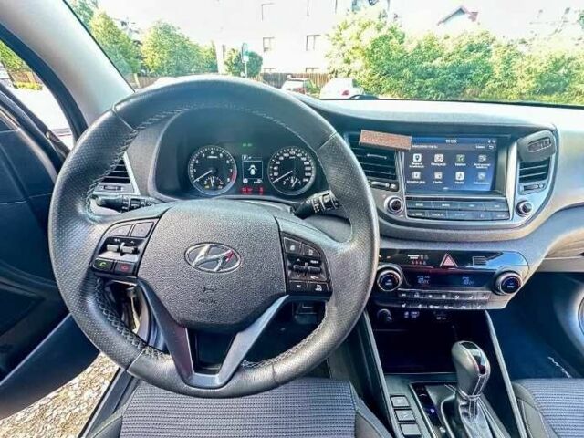 Серый Хендай Туксон, объемом двигателя 2.4 л и пробегом 94 тыс. км за 10700 $, фото 14 на Automoto.ua