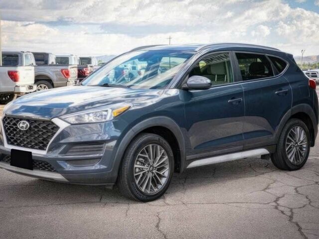 Серый Хендай Туксон, объемом двигателя 2.4 л и пробегом 33 тыс. км за 14000 $, фото 2 на Automoto.ua