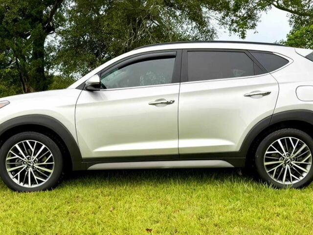 Серый Хендай Туксон, объемом двигателя 2.4 л и пробегом 39 тыс. км за 9500 $, фото 3 на Automoto.ua