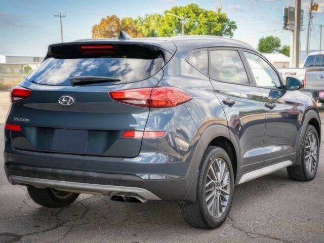 Серый Хендай Туксон, объемом двигателя 2.4 л и пробегом 33 тыс. км за 14000 $, фото 5 на Automoto.ua