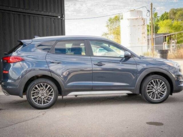 Серый Хендай Туксон, объемом двигателя 2.4 л и пробегом 33 тыс. км за 14000 $, фото 3 на Automoto.ua