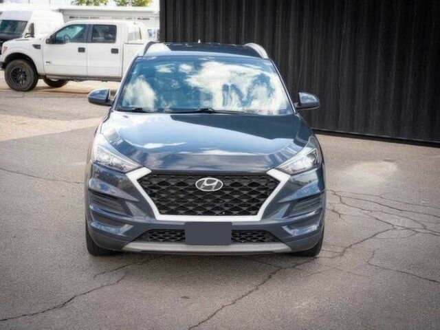 Серый Хендай Туксон, объемом двигателя 2.4 л и пробегом 33 тыс. км за 14000 $, фото 1 на Automoto.ua