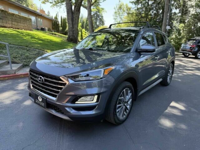 Серый Хендай Туксон, объемом двигателя 2.4 л и пробегом 23 тыс. км за 5400 $, фото 2 на Automoto.ua