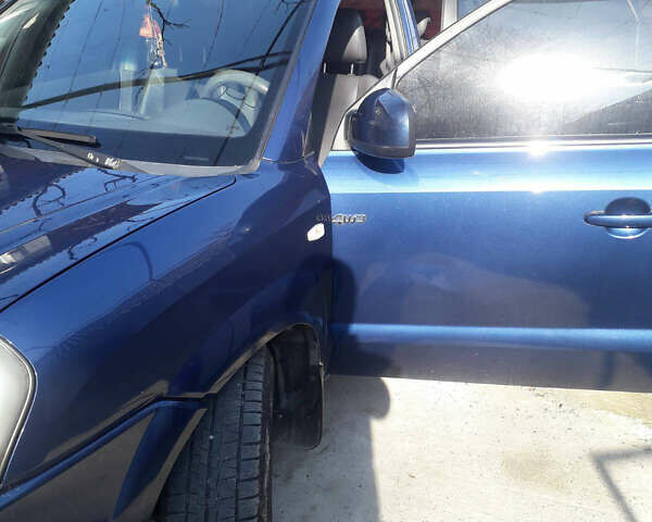 Синий Хендай Туксон, объемом двигателя 2 л и пробегом 223 тыс. км за 7700 $, фото 6 на Automoto.ua