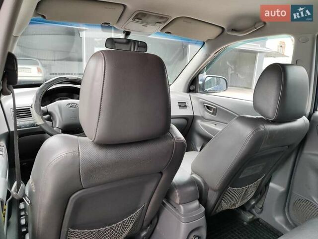 Синий Хендай Туксон, объемом двигателя 1.99 л и пробегом 225 тыс. км за 8000 $, фото 14 на Automoto.ua