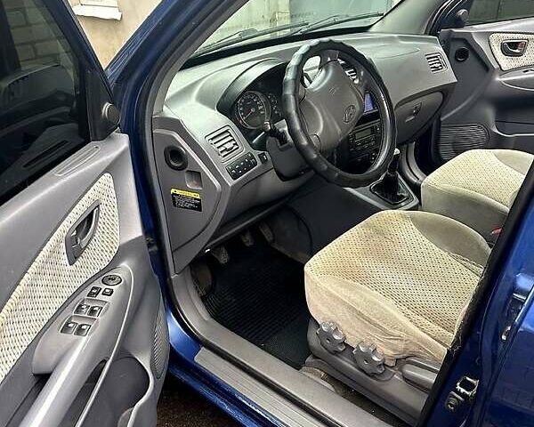 Синий Хендай Туксон, объемом двигателя 2 л и пробегом 224 тыс. км за 8300 $, фото 8 на Automoto.ua