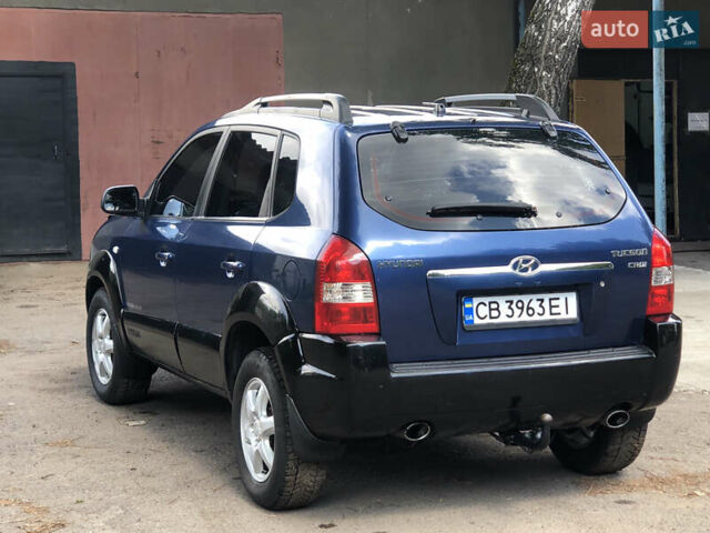 Синий Хендай Туксон, объемом двигателя 1.99 л и пробегом 315 тыс. км за 6700 $, фото 6 на Automoto.ua