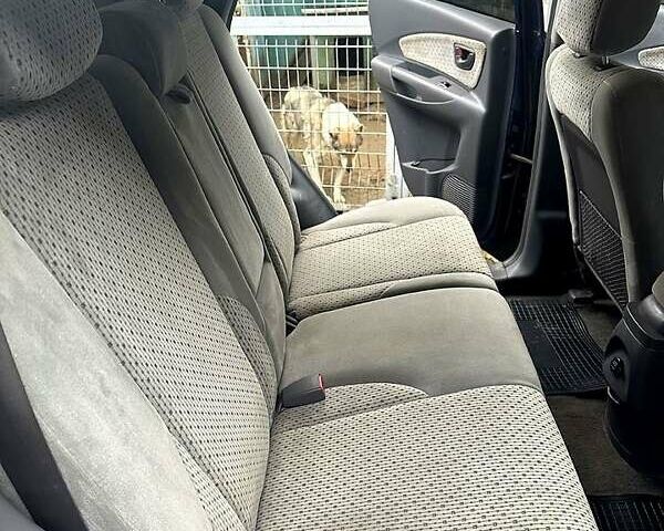 Синий Хендай Туксон, объемом двигателя 2 л и пробегом 224 тыс. км за 8300 $, фото 5 на Automoto.ua