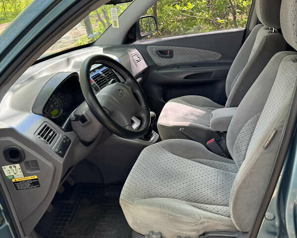 Синий Хендай Туксон, объемом двигателя 1.99 л и пробегом 272 тыс. км за 6800 $, фото 20 на Automoto.ua