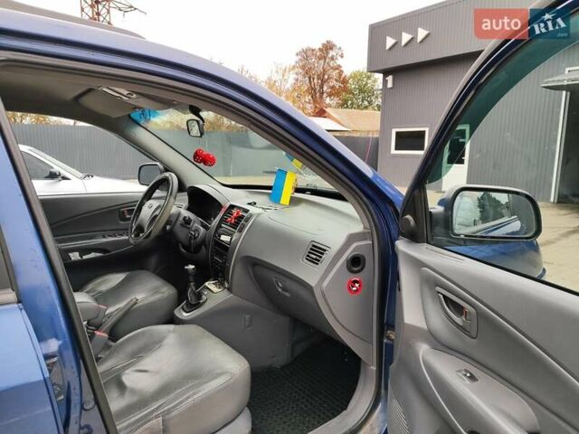 Синий Хендай Туксон, объемом двигателя 1.99 л и пробегом 225 тыс. км за 8000 $, фото 16 на Automoto.ua