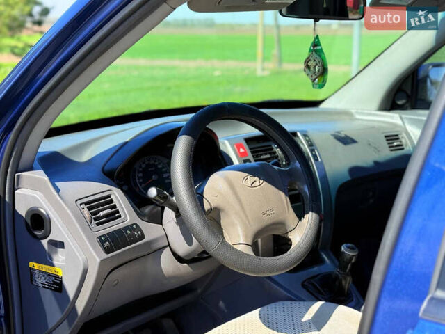 Синий Хендай Туксон, объемом двигателя 2 л и пробегом 320 тыс. км за 6300 $, фото 14 на Automoto.ua