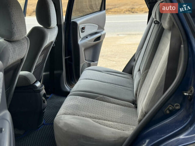Синій Хендай Туксон, об'ємом двигуна 1.99 л та пробігом 299 тис. км за 7200 $, фото 33 на Automoto.ua