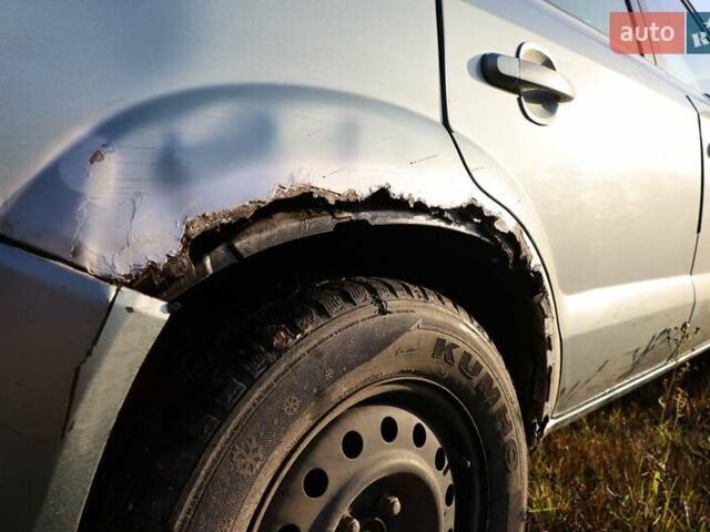 Синий Хендай Туксон, объемом двигателя 1.98 л и пробегом 280 тыс. км за 4800 $, фото 7 на Automoto.ua