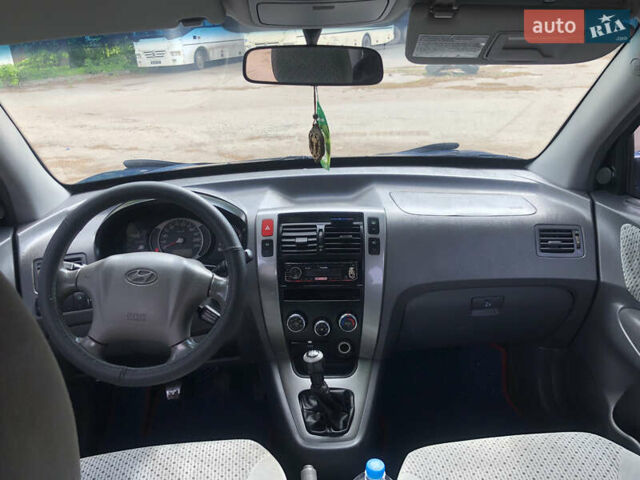Синий Хендай Туксон, объемом двигателя 1.99 л и пробегом 315 тыс. км за 6700 $, фото 20 на Automoto.ua