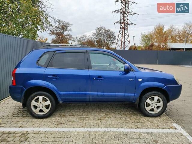 Синий Хендай Туксон, объемом двигателя 1.99 л и пробегом 225 тыс. км за 8000 $, фото 4 на Automoto.ua