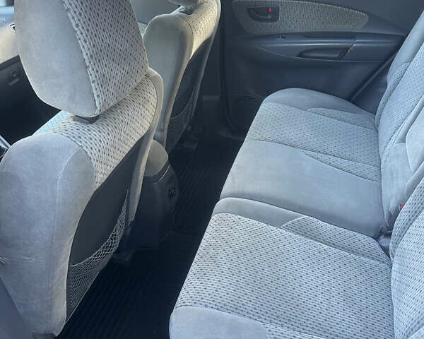 Синий Хендай Туксон, объемом двигателя 1.98 л и пробегом 218 тыс. км за 7300 $, фото 9 на Automoto.ua