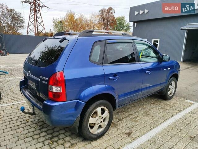 Синий Хендай Туксон, объемом двигателя 1.99 л и пробегом 225 тыс. км за 8000 $, фото 5 на Automoto.ua