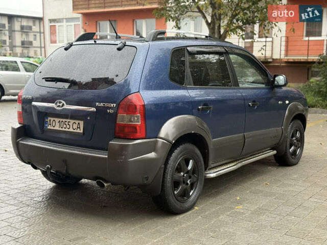 Синий Хендай Туксон, объемом двигателя 2.66 л и пробегом 321 тыс. км за 5500 $, фото 6 на Automoto.ua