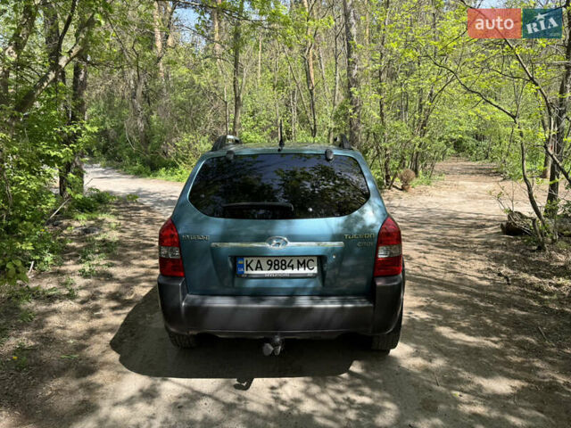 Синий Хендай Туксон, объемом двигателя 1.99 л и пробегом 272 тыс. км за 6800 $, фото 6 на Automoto.ua
