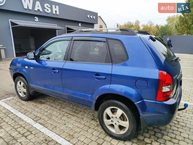 Синий Хендай Туксон, объемом двигателя 1.99 л и пробегом 225 тыс. км за 8000 $, фото 6 на Automoto.ua