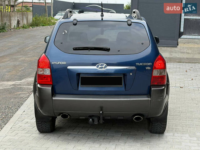 Синий Хендай Туксон, объемом двигателя 2.66 л и пробегом 320 тыс. км за 6300 $, фото 5 на Automoto.ua