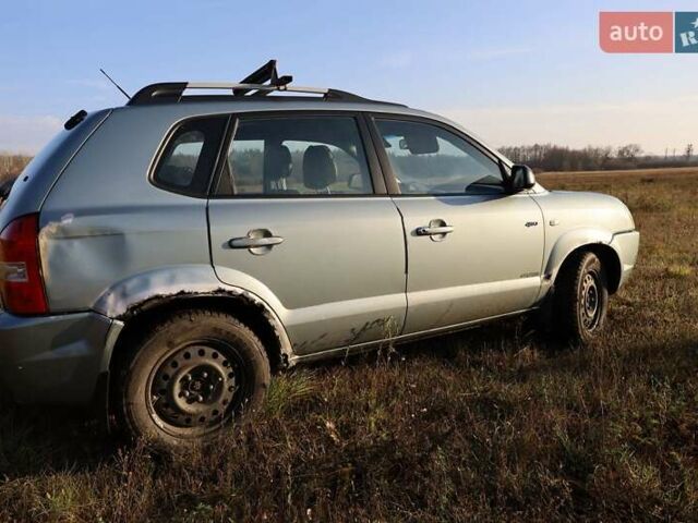 Синий Хендай Туксон, объемом двигателя 1.98 л и пробегом 280 тыс. км за 4800 $, фото 6 на Automoto.ua