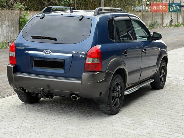 Синий Хендай Туксон, объемом двигателя 2.66 л и пробегом 320 тыс. км за 6300 $, фото 4 на Automoto.ua