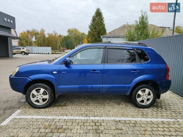 Синий Хендай Туксон, объемом двигателя 1.99 л и пробегом 225 тыс. км за 8000 $, фото 3 на Automoto.ua