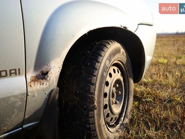 Синий Хендай Туксон, объемом двигателя 1.98 л и пробегом 280 тыс. км за 4800 $, фото 8 на Automoto.ua