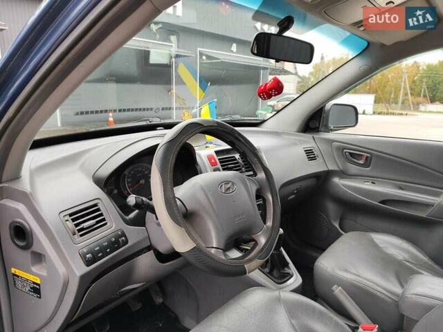 Синий Хендай Туксон, объемом двигателя 1.99 л и пробегом 225 тыс. км за 8000 $, фото 9 на Automoto.ua