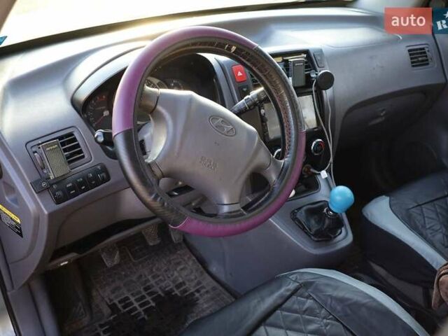 Синий Хендай Туксон, объемом двигателя 1.98 л и пробегом 280 тыс. км за 4800 $, фото 14 на Automoto.ua