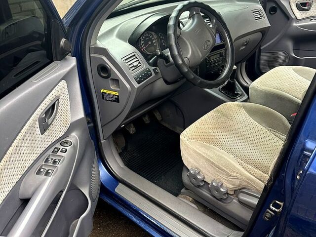 Синий Хендай Туксон, объемом двигателя 2 л и пробегом 224 тыс. км за 8300 $, фото 9 на Automoto.ua