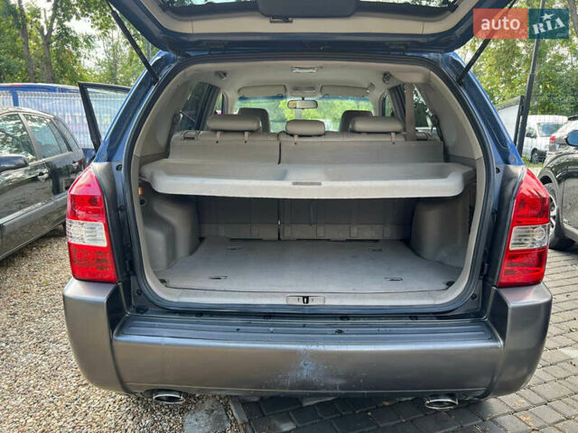 Синій Хендай Туксон, об'ємом двигуна 2 л та пробігом 245 тис. км за 6800 $, фото 14 на Automoto.ua