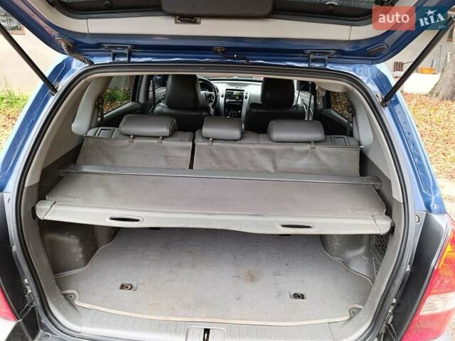 Синий Хендай Туксон, объемом двигателя 2 л и пробегом 314 тыс. км за 6700 $, фото 4 на Automoto.ua