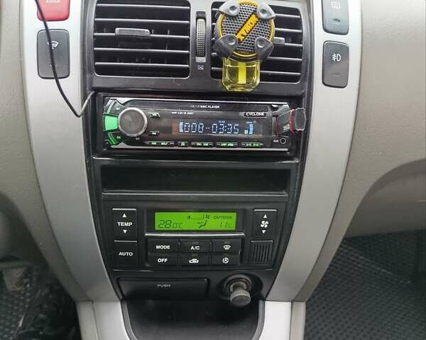 Синий Хендай Туксон, объемом двигателя 2 л и пробегом 314 тыс. км за 6700 $, фото 16 на Automoto.ua