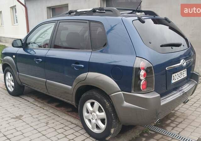Синий Хендай Туксон, объемом двигателя 2.66 л и пробегом 320 тыс. км за 5500 $, фото 3 на Automoto.ua