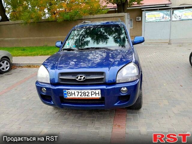 Синій Хендай Туксон, об'ємом двигуна 2 л та пробігом 205 тис. км за 7700 $, фото 3 на Automoto.ua