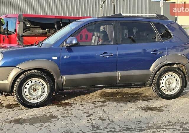Синий Хендай Туксон, объемом двигателя 1.99 л и пробегом 313 тыс. км за 6000 $, фото 7 на Automoto.ua